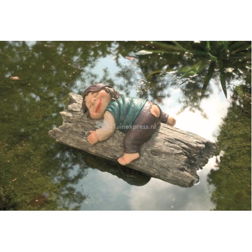 Kind slapend op hout drijffiguur